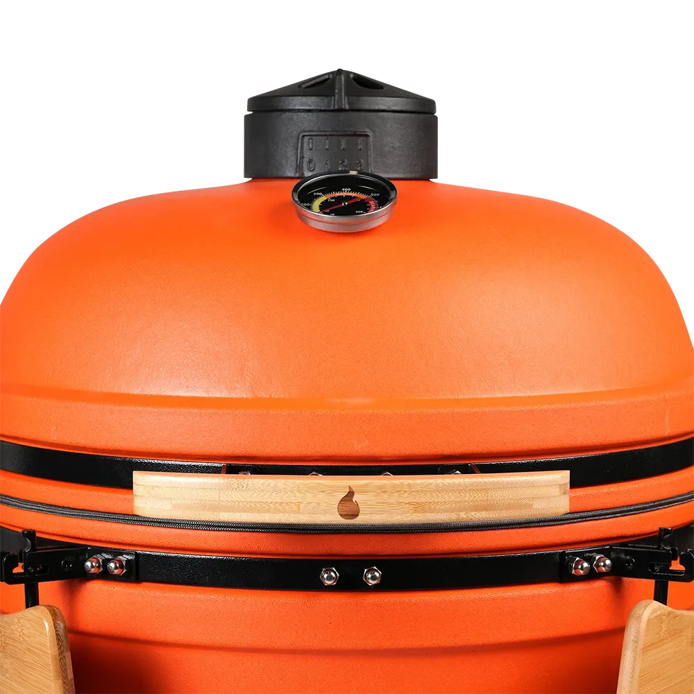 Close-up of a desert-orange kamado dome and its top vent